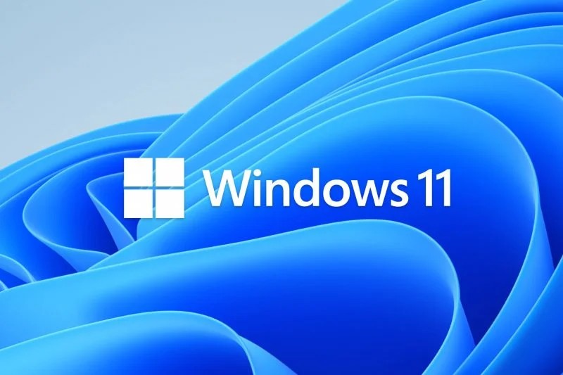 Windows 11 logo with blue waves background
